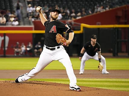 Jul 6, 2022; Phoenix, Arizona, USA; Arizona Diamondbacks starting pitcher Merrill Kelly (29) throws to the San Francisco Giants in the first inning at Chase Field. Mandatory Credit: Rob Schumacher-Arizona Republic

Mlb San Franicsco Giants At Arizona Diamondbacks