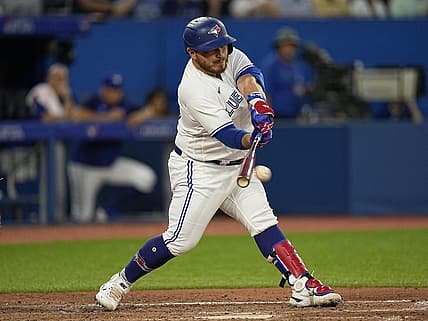 Jul 12, 2022; Toronto, Ontario, CAN; Toronto Blue Jays designated hitter Alejandro Kirk (30) hits a single against the Philadelphia Phillies during the sixth inning at Rogers Centre. Mandatory Credit: John E. Sokolowski-USA TODAY Sports