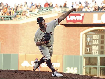 Jul 14, 2022; San Francisco, California, USA; San Francisco Giants starting pitcher Carlos Rodon (16) pitches a third strike-out in a row with the bases loaded against the the Milwaukee Brewers during the second inning at Oracle Park. Mandatory Credit: Kelley L Cox-USA TODAY Sports