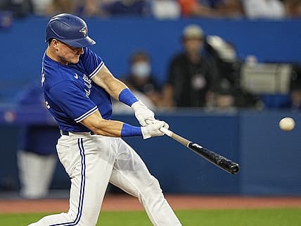Jul 15, 2022; Toronto, Ontario, CAN; Toronto Blue Jays third baseman Matt Chapman (26) hits a three run home run against the Kansas City Royals during the fifth inning at Rogers Centre. Mandatory Credit: John E. Sokolowski-USA TODAY Sports