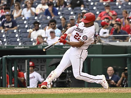 Jul 17, 2022; Washington, District of Columbia, USA;  Washington Nationals right fielder Juan Soto (22) hits a solo home run against the Atlanta Braves during the eighth inning at Nationals Park. Mandatory Credit: James A. Pittman-USA TODAY Sports