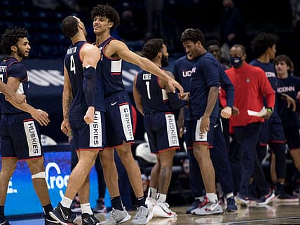 Connecticut Huskies guard Andre Jackson (44) celebrates with Connecticut Huskies guard Tyrese Martin (4) after the NCAA men's basketball game on Saturday, Feb. 13, 2021, in Cincinnati. Connecticut Huskies defeated Xavier Musketeers 80-72.

Connecticut At Xavier