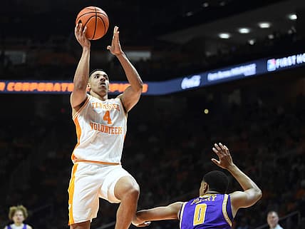 Tennessee guard Tyreke Key (4) tries to score over Tennessee Tech guard Ty Perry (0) during an NCAA college basketball game between Tennessee and Tennessee Tech on Monday, November 7, 2022 in Knoxville, Tenn.

Kns Vols Hoops Tntech