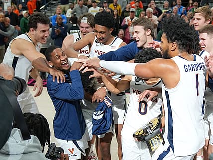 Nov 20, 2022; Las Vegas, Nevada, USA; Virginia Cavaliers guard Reece Beekman (2) is congratulated by team mates after being named Most Valuable Player of the Continental Tire Main Event Championship game against the Illinois Fighting Illini at T-Mobile Arena. Mandatory Credit: Stephen R. Sylvanie-USA TODAY Sports