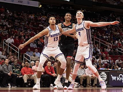 Feb 6, 2023; Houston, Texas, USA; Sacramento Kings forward Keegan Murray (13) and Sacramento Kings guard Kevin Huerter (9) block out Houston Rockets forward Jabari Smith Jr. (1) in the second quarter at Toyota Center. Mandatory Credit: Thomas Shea-USA TODAY Sports
