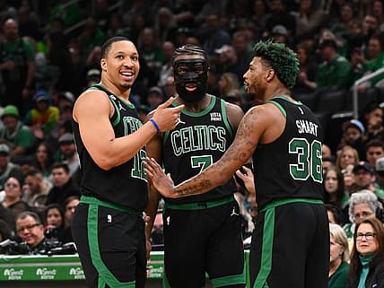 Mar 26, 2023; Boston, Massachusetts, USA; Boston Celtics forward Grant Williams (12), guard Jaylen Brown (7), and guard Marcus Smart (36) talk during a timeout during a game against the San Antonio Spurs at the TD Garden. Mandatory Credit: Brian Fluharty-USA TODAY Sports