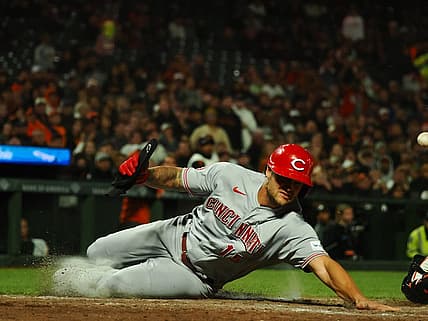 Aug 28, 2023; San Francisco, California, USA; Cincinnati Reds left fielder Nick Senzel (15) scores a run against the San Francisco Giants during the eighth inning at Oracle Park. Mandatory Credit: Kelley L Cox-USA TODAY Sports