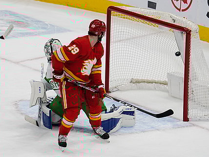 Mar 19, 2021; Toronto, Ontario, CAN; Calgary Flames forward Dillon Dube (29) watches a shot by Calgary Flames defenseman Christopher Tanev (not pictured) score on Toronto Maple Leafs goaltender Frederik Andersen (31) during the first period at Scotiabank Arena. Mandatory Credit: John E. Sokolowski-USA TODAY Sports
