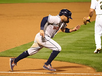 Apr 1, 2021; Oakland, California, USA; Houston Astros second baseman Jose Altuve (27) scores a run on a ground out against the Oakland Athletics during the ninth inning at RingCentral Coliseum. Mandatory Credit: Kelley L Cox-USA TODAY Sports