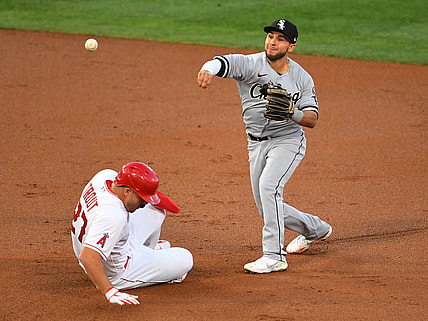 Apr 2, 2021; Anaheim, California, USA;  Chicago White Sox second baseman Nick Madrigal (1) throws to first as Los Angeles Angels center fielder Mike Trout (27) is out on a double play to end the first inning of the game at Angel Stadium. Mandatory Credit: Jayne Kamin-Oncea-USA TODAY Sports
