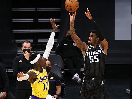 Apr 2, 2021; Sacramento, California, USA; Sacramento Kings guard Delon Wright (55) shoots the ball above Los Angeles Lakers guard Dennis Schroder (17) during the third quarter at Golden 1 Center. Mandatory Credit: Kelley L Cox-USA TODAY Sports