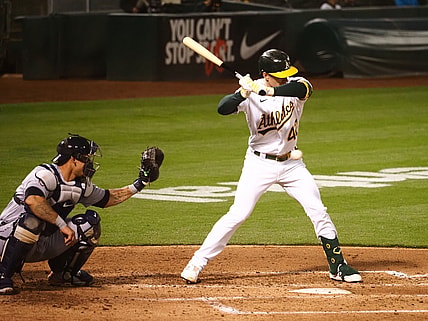 Apr 15, 2021; Oakland, California, USA; Oakland Athletics right fielder Mark Canha avoids the ball to earn a walk against the Detroit Tigers during the fourth inning at RingCentral Coliseum. Mandatory Credit: Kelley L Cox-USA TODAY Sports
