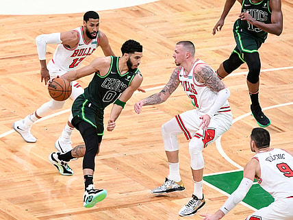 Apr 19, 2021; Boston, Massachusetts, USA; Boston Celtics forward Jayson Tatum (0) drives to the basket Chicago Bulls center Daniel Theis (27) during the first half at the TD Garden. Mandatory Credit: Brian Fluharty-USA TODAY Sports