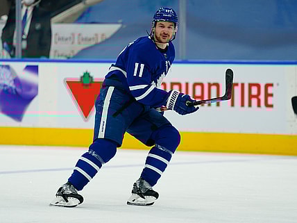 Apr 13, 2021; Toronto, Ontario, CAN; Toronto Maple Leafs forward Zach Hyman (11) skates against the Calgary Flames during the first period at Scotiabank Arena. Mandatory Credit: John E. Sokolowski-USA TODAY Sports