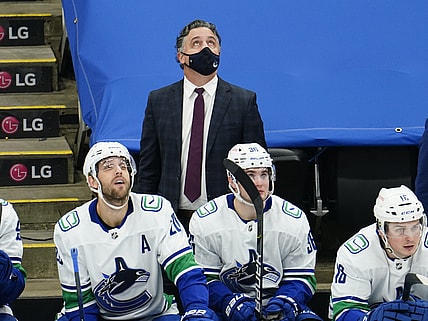 Feb 4, 2021; Toronto, Ontario, CAN; Vancouver Canucks head coach Travis Green looks up at the scoreboard during the third period against the Toronto Maple Leafs at Scotiabank Arena. Toronto defeated Vancouver. Mandatory Credit: John E. Sokolowski-USA TODAY Sports