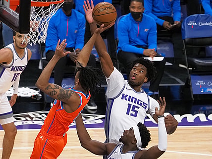 May 9, 2021; Sacramento, California, USA; Sacramento Kings center Damian Jones (15) blocks the shot by Oklahoma City Thunder forward Josh Hall (15) during the first quarter at Golden 1 Center. Mandatory Credit: Kelley L Cox-USA TODAY Sports