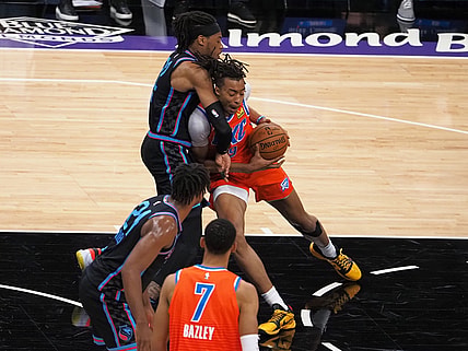May 11, 2021; Sacramento, California, USA; Oklahoma City Thunder center Moses Brown (9) drives in against Sacramento Kings forward Richaun Holmes (22) during the first quarter at Golden 1 Center. Mandatory Credit: Kelley L Cox-USA TODAY Sports