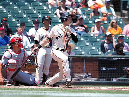 Jun 19, 2021; San Francisco, California, USA; San Francisco Giants left fielder Mike Yastrzemski (5) hits a two-run home run against the Philadelphia Phillies during the first inning at Oracle Park. Mandatory Credit: Kelley L Cox-USA TODAY Sports