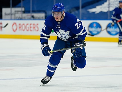 Apr 13, 2021; Toronto, Ontario, CAN; Toronto Maple Leafs defenseman Travis Dermott (23) skates against the Calgary Flames during the second period at Scotiabank Arena. Mandatory Credit: John E. Sokolowski-USA TODAY Sports