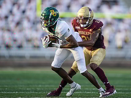Sep 4, 2021; San Marcos, Texas, USA;  Baylor Bears wide receiver Tyquan Thornton (9) runs the ball against Texas State Bobcats cornerback Michael LoVett III (21) in the second quarter at Bobcat Stadium. Mandatory Credit: Daniel Dunn-USA TODAY Sports