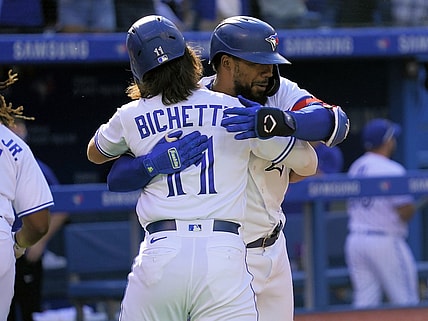 Sep 18, 2021; Toronto, Ontario, CAN; Toronto Blue Jays shortstop Bo Bichette (11) congratulates right fielder Teoscar Hernandez (37) on his three-run home run against the Minnesota Twins during the fourth inning at Rogers Centre. Mandatory Credit: John E. Sokolowski-USA TODAY Sports