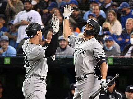 Sep 30, 2021; Toronto, Ontario, CAN;   New York Yankees right fielder Aaron Judge (99) is greeted by left fielder Giancarlo Stanton (27) after hitting a solo home run against Toronto Blue Jays in the first inning at Rogers Centre. Mandatory Credit: Dan Hamilton-USA TODAY Sports