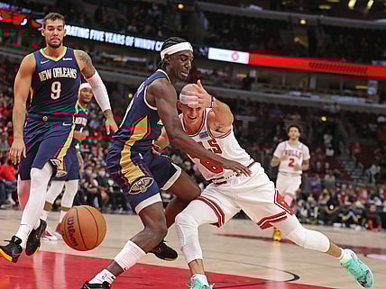 Oct 8, 2021; Chicago, Illinois, USA; Chicago Bulls guard Alex Caruso (6) collides with New Orleans Pelicans guard Kira Lewis Jr. (13) during the second half at the United Center. Mandatory Credit: Dennis Wierzbicki-USA TODAY Sports