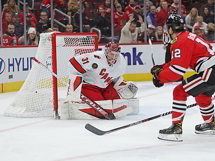 Nov 3, 2021; Chicago, Illinois, USA; Carolina Hurricanes goaltender Frederik Andersen (31) makes a save on a shot from Chicago Blackhawks left wing Alex DeBrincat (12) during the third period at the United Center. Mandatory Credit: Dennis Wierzbicki-USA TODAY Sports