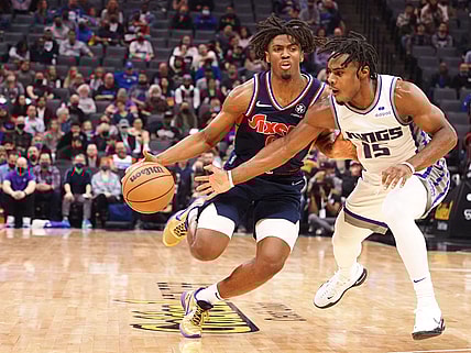 Nov 22, 2021; Sacramento, California, USA; Philadelphia 76ers guard Tyrese Maxey (0) drives in against Sacramento Kings guard Davion Mitchell (15) during the second quarter at Golden 1 Center. Mandatory Credit: Kelley L Cox-USA TODAY Sports