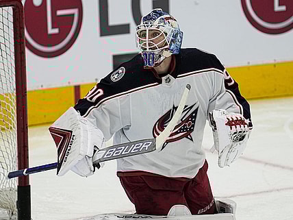 Dec 7, 2021; Toronto, Ontario, CAN; Columbus Blue Jackets goaltender Elvis Merzlikins (90) follows a rebound during warm up against the Toronto Maple Leafs at Scotiabank Arena. Mandatory Credit: John E. Sokolowski-USA TODAY Sports