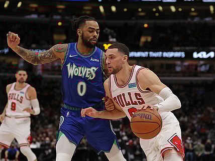 Feb 11, 2022; Chicago, Illinois, USA; Chicago Bulls guard Zach LaVine (8) drives around Minnesota Timberwolves guard D'Angelo Russell (0) during the first half at the United Center. Mandatory Credit: Dennis Wierzbicki-USA TODAY Sports