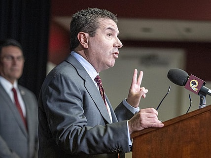 Jan 2, 2020; Ashburn, VA, USA; Washington Redskins head coach Ron Rivera looks on as owner Daniel Snyder speaks during his introductory press conference at Inova Sports Performance Center. Mandatory Credit: Brad Mills-USA TODAY Sports