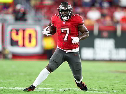 Oct 27, 2022; Tampa, Florida, USA;  Tampa Bay Buccaneers running back Leonard Fournette (7) runs with the ball against the Baltimore Ravens in the fourth quarter at Raymond James Stadium. Mandatory Credit: Nathan Ray Seebeck-USA TODAY Sports
