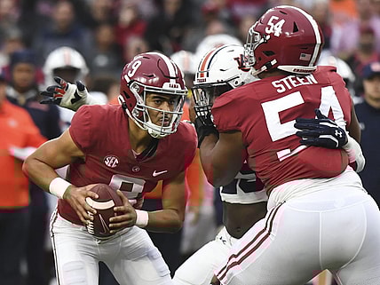 Nov 26, 2022; Tuscaloosa, Alabama, USA; Alabama Crimson Tide quarterback Bryce Young (9) drops back to pass as offensive lineman Tyler Steen (54) blocls against the Auburn Tigers at Bryant-Denny Stadium. Alabama won 49-27. Mandatory Credit: Gary Cosby Jr.-USA TODAY Sports