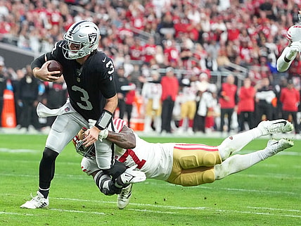 Jan 1, 2023; Paradise, Nevada, USA; San Francisco 49ers linebacker Dre Greenlaw (57) tackles Las Vegas Raiders quarterback Jarrett Stidham (3) during the first half at Allegiant Stadium. Mandatory Credit: Stephen R. Sylvanie-USA TODAY Sports