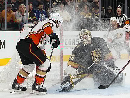 Feb 12, 2023; Las Vegas, Nevada, USA; Vegas Golden Knights goaltender Adin Hill (33) defends his net against Anaheim Ducks center Adam Henrique (14) during the first period at T-Mobile Arena. Mandatory Credit: Stephen R. Sylvanie-USA TODAY Sports