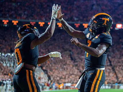 Tennessee running back Jaylen Wright (0) and quarterback Joe Milton III (7) celebrate Wright's touchdown during an NCAA college football game between Tennessee and South Carolina in Knoxville, Tenn., on Saturday, Sept. 30, 2023.