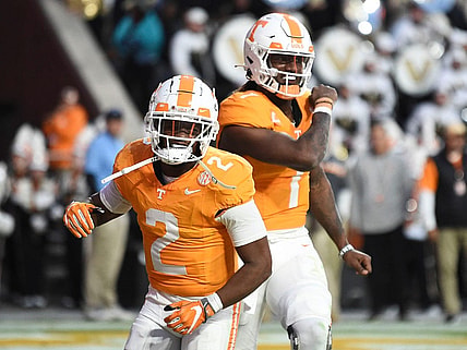 Tennessee quarterback Joe Milton III (7) and Jabari Small (2) celebrate Milton's touchdown during an NCAA college football game against Vanderbilt on Saturday, November 25, 2023 in Knoxville, Tenn.