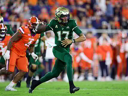 Dec 21, 2023; Boca Raton, FL, USA; South Florida Bulls quarterback Byrum Brown (17) drops back to pass against the Syracuse Orange in the first quarter during the RoofClaim.com Boca Raton Bowl at FAU Stadium. Mandatory Credit: Nathan Ray Seebeck-USA TODAY Sports