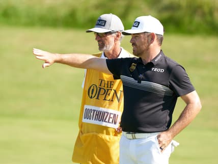 Jul 16, 2021; Sandwich, England, GB; Louis Oosthuizen  looks over his putt on the sixth green during the second  round of the Open Championship golf tournament. Mandatory Credit: Peter van den Berg-USA TODAY Sports