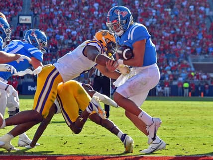 Oct 23, 2021; Oxford, Mississippi, USA; Mississippi Rebels quarterback Matt Corral (2) rushes for a touchdown during the first half against the LSU Tigers at Vaught-Hemingway Stadium. Mandatory Credit: Justin Ford-USA TODAY Sports