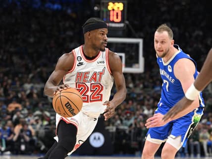 Feb 4, 2023; Milwaukee, Wisconsin, USA; Miami Heat forward Jimmy Butler (22) drives to the basket against Milwaukee Bucks guard Joe Ingles (7) in the second half at Fiserv Forum. Mandatory Credit: Michael McLoone-USA TODAY Sports
