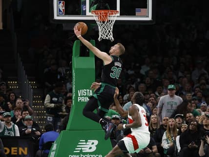 Apr 7, 2023; Boston, Massachusetts, USA; Boston Celtics forward Sam Hauser (30) goes past Toronto Raptors forward O.G. Anunoby (3) for a basket during the first quarter at TD Garden. Mandatory Credit: Winslow Townson-USA TODAY Sports