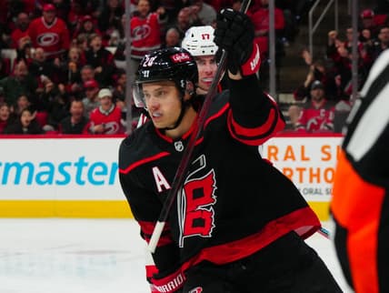 Jan 25, 2024; Raleigh, North Carolina, USA;  Carolina Hurricanes center Sebastian Aho (20) scores a goal against the New Jersey Devils during the first period at PNC Arena. Mandatory Credit: James Guillory-USA TODAY Sports