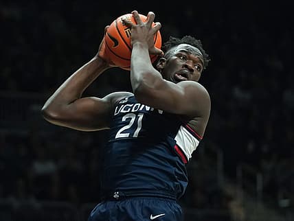 Dec 17, 2022; Indianapolis, Indiana, USA;  Connecticut Huskies forward Adama Sanogo (21) rebounds the ball against the Butler Bulldogs during the first half at Hinkle Fieldhouse. Mandatory Credit: Robert Goddin-USA TODAY Sports