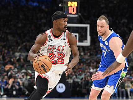 Feb 4, 2023; Milwaukee, Wisconsin, USA; Miami Heat forward Jimmy Butler (22) drives to the basket against Milwaukee Bucks guard Joe Ingles (7) in the second half at Fiserv Forum. Mandatory Credit: Michael McLoone-USA TODAY Sports