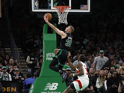Apr 7, 2023; Boston, Massachusetts, USA; Boston Celtics forward Sam Hauser (30) goes past Toronto Raptors forward O.G. Anunoby (3) for a basket during the first quarter at TD Garden. Mandatory Credit: Winslow Townson-USA TODAY Sports