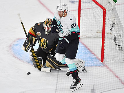 Oct 12, 2021; Las Vegas, Nevada, USA; Vegas Golden Knights goaltender Robin Lehner (90) protects his net as Seattle Kraken center Alex Wennberg (21) waits to deflect an incoming shot during the first period at T-Mobile Arena. Mandatory Credit: Stephen R. Sylvanie-USA TODAY Sports