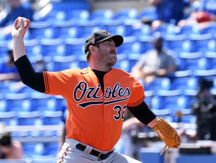 Mar 5, 2021; Dunedin, Florida, USA; Baltimore Orioles pitcher Matt Harvey (32) throws a pitch in the first inning against the Toronto Blue Jays during spring training at TD Ballpark. Mandatory Credit: Jonathan Dyer-USA TODAY Sports