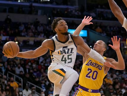 Jan 17, 2022; Los Angeles, California, USA; Los Angeles Lakers guard Avery Bradley (20) defends Utah Jazz guard Donovan Mitchell (45) as he passes the ball in the second half of the game at Crypto.com Arena. Mandatory Credit: Jayne Kamin-Oncea-USA TODAY Sports